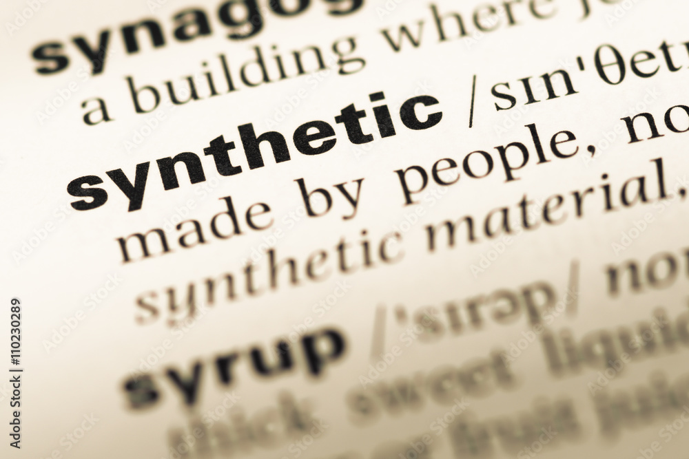 Close up of old English dictionary page with word synthetic Close up of old English dictionary page with word synthetic