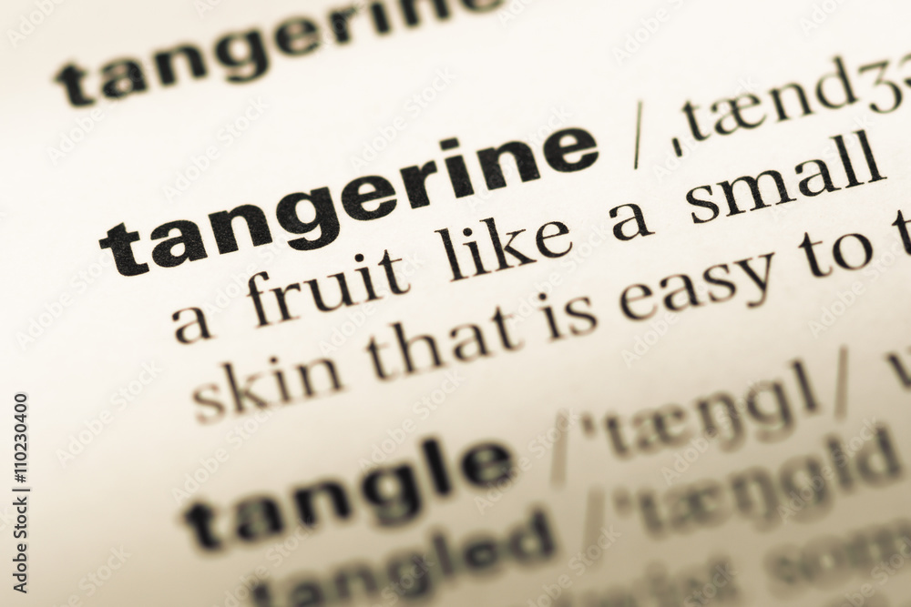 Close up of old English dictionary page with word tangerine Close up of old English dictionary page with word tangerine