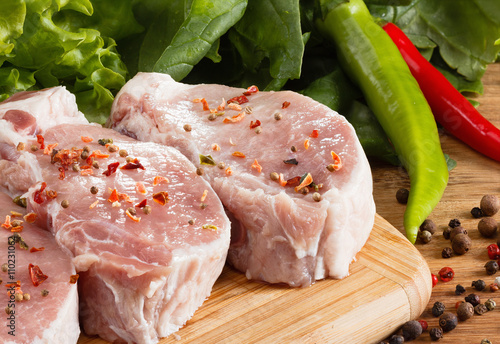 Raw steak with vegetables, ...