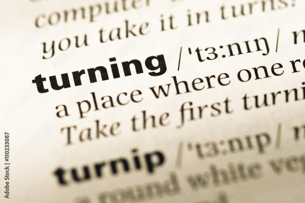 Close up of old English dictionary page with word turning Close up of old English dictionary page with word turning