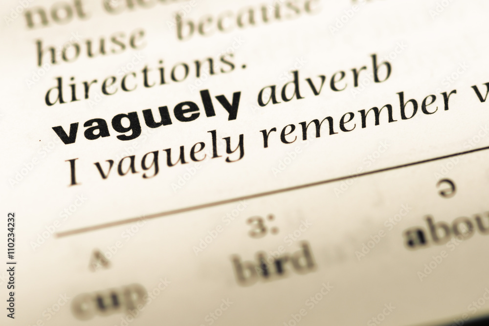 Close up of old English dictionary page with word vaguely Close up of old English dictionary page with word vaguely