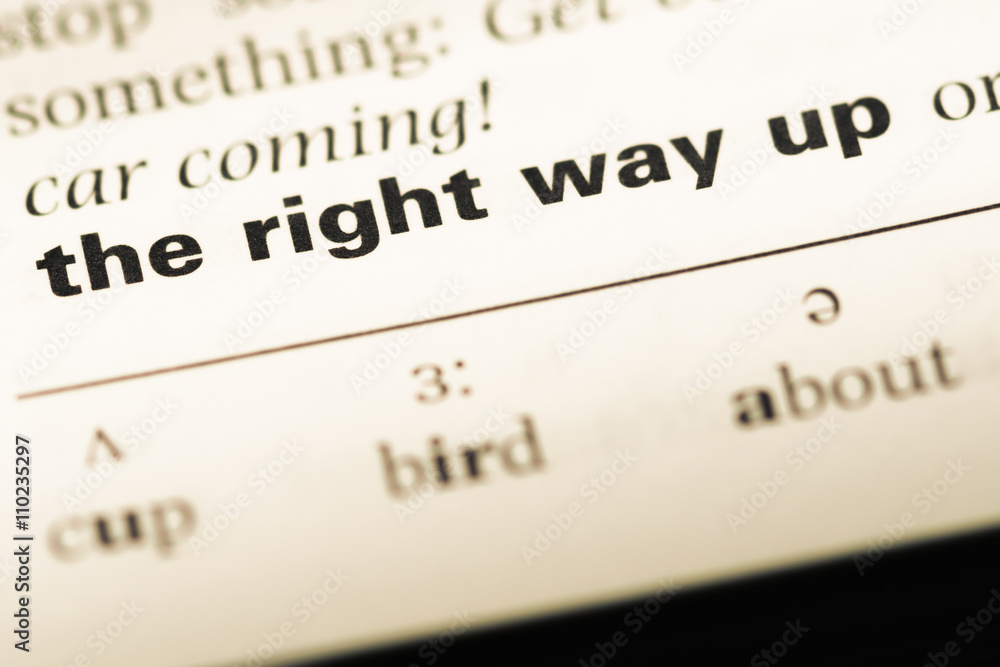 Close up of old English dictionary page with word the right way Close up of old English dictionary page with word the right way