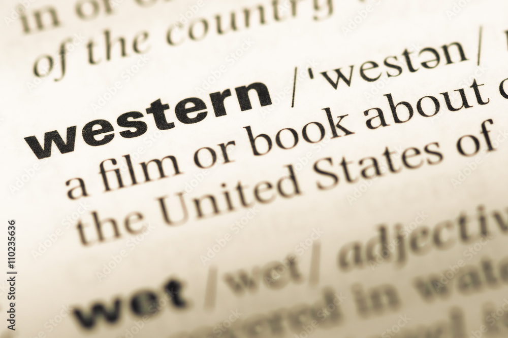 Close up of old English dictionary page with word western Close up of old English dictionary page with word western