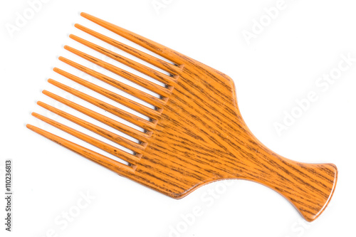 Orange afro pick on white background
