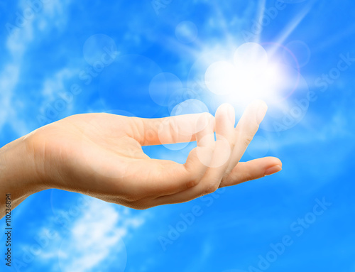 Female hand with sun
