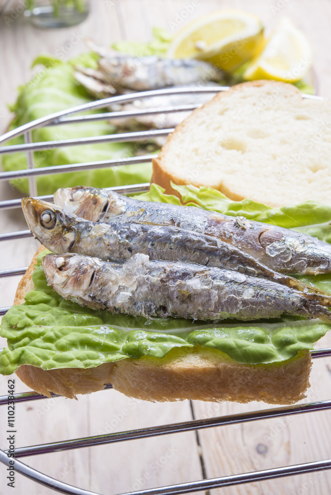 Sandwich Kamut, tapas with sardines, sprats with olives and herb Sandwich Kamut, tapas with sardines, sprats with olives and herb