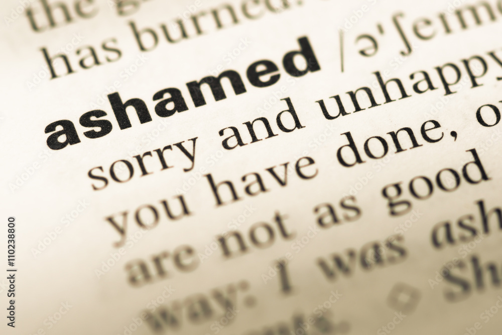 Close up of old English dictionary page with word ashamed Close up of old English dictionary page with word ashamed