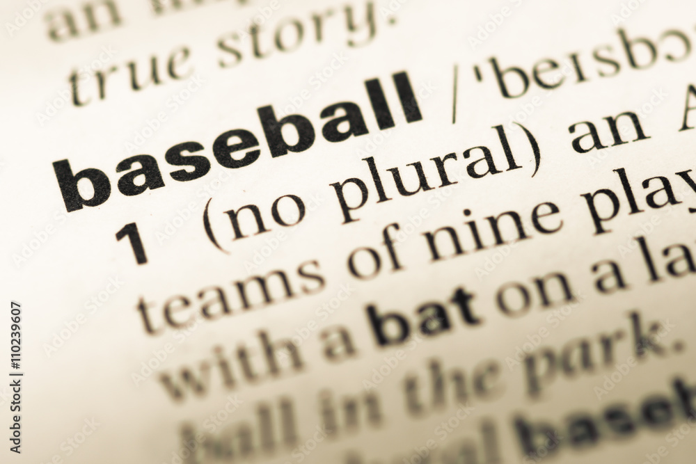 Close up of old English dictionary page with word baseball Close up of old English dictionary page with word baseball