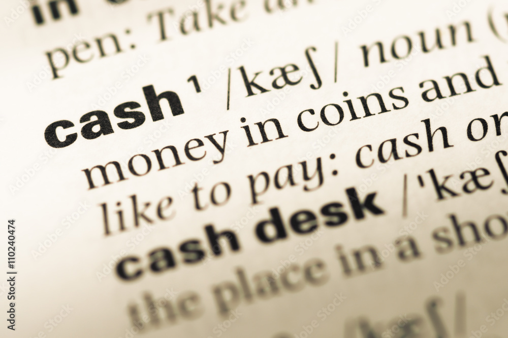 Close up of old English dictionary page with word cash Close up of old English dictionary page with word cash