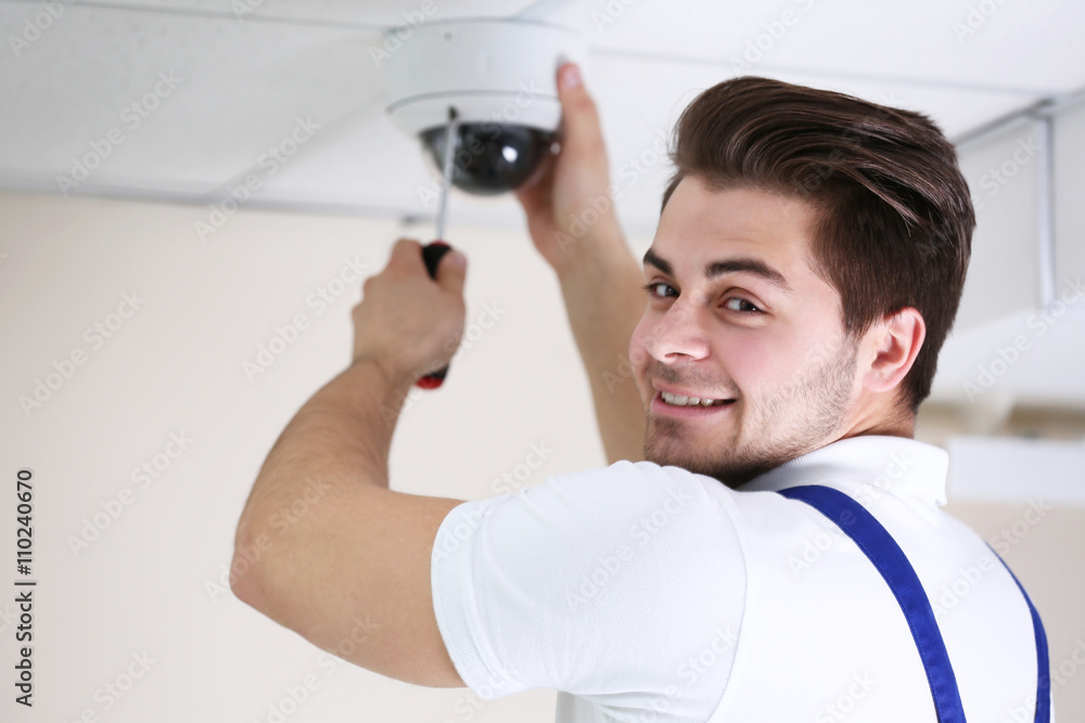 Professional CCTV technician working. Professional CCTV technician working.