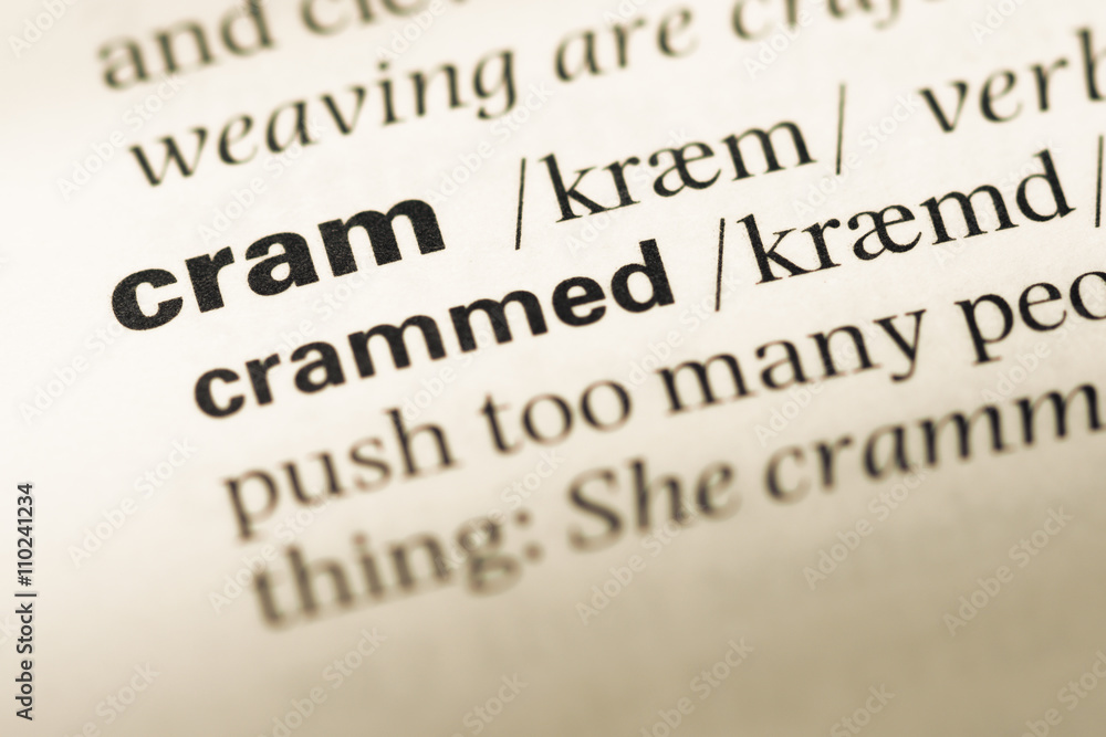 Close up of old English dictionary page with word cram Close up of old English dictionary page with word cram