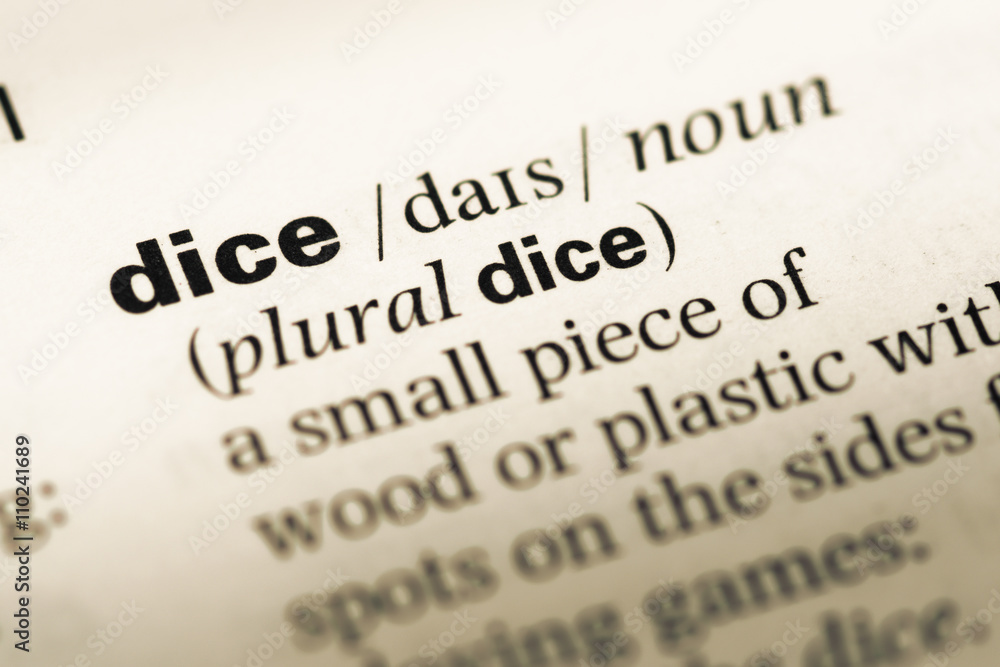 Close up of old English dictionary page with word dice Close up of old English dictionary page with word dice