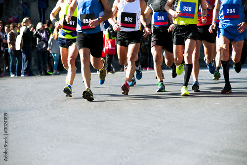 runners' legs in a marathon