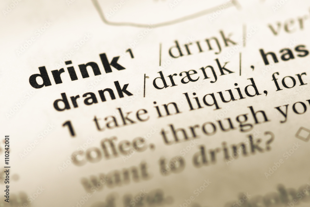Obraz premium Close up of old English dictionary page with word drink