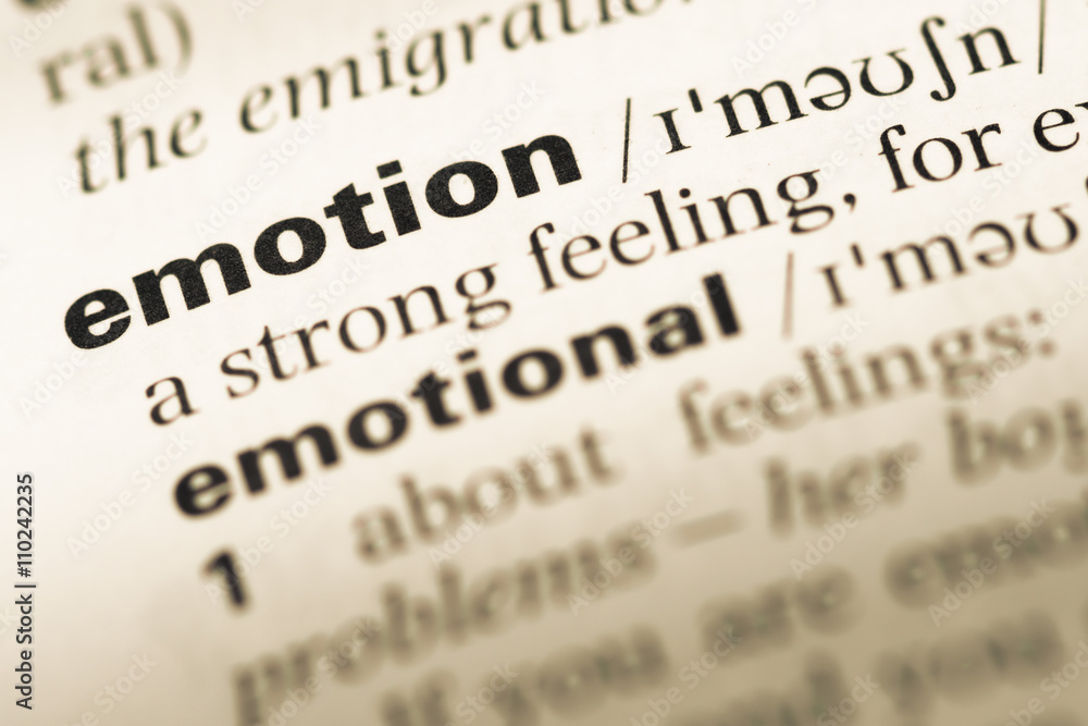 Close up of old English dictionary page with word emotion Close up of old English dictionary page with word emotion