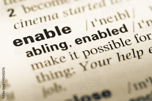 Close up of old English dictionary page with word enable