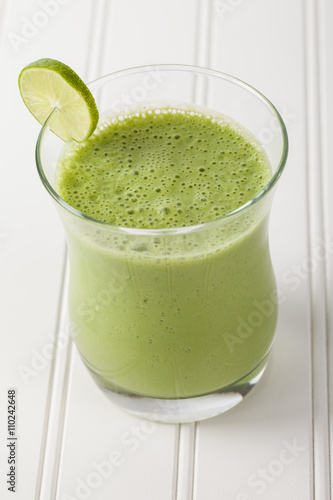 Lime green pineapple smoothie angled view
