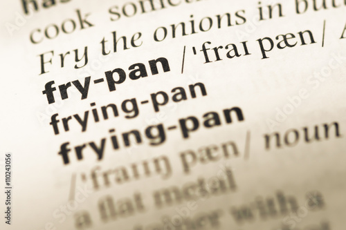 Close up of old English dictionary page with word fry pan