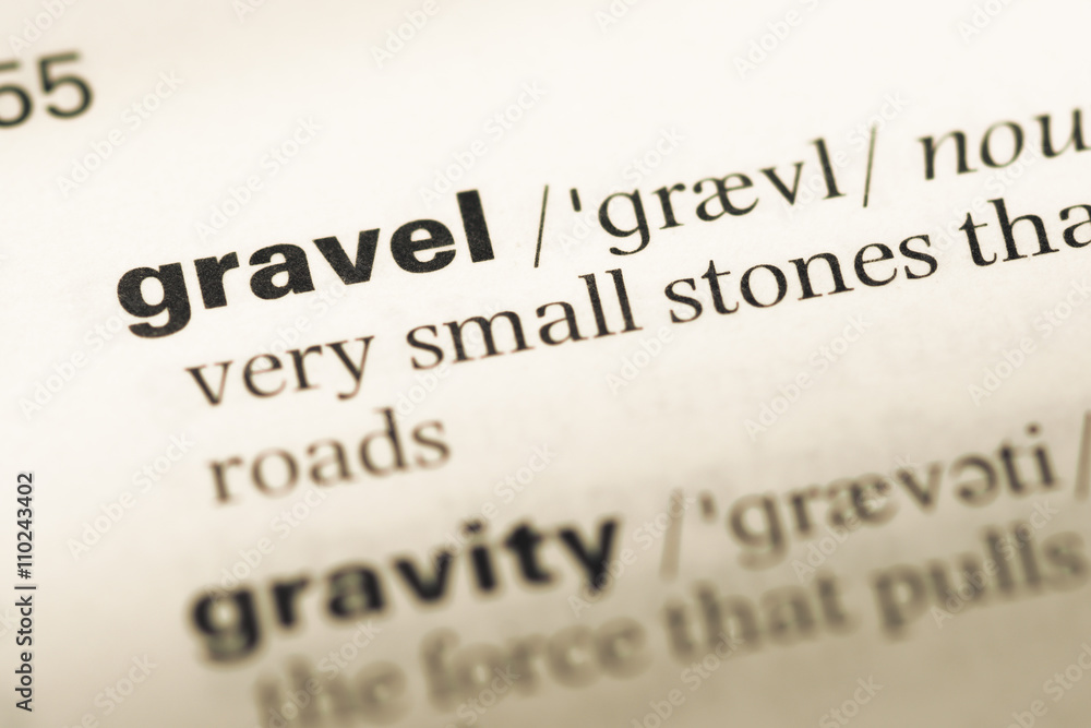 Close up of old English dictionary page with word gravel Close up of old English dictionary page with word gravel