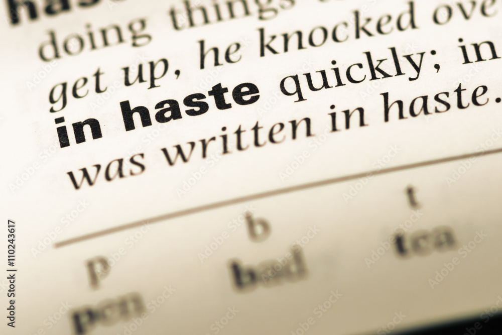 Close up of old English dictionary page with word in haste Close up of old English dictionary page with word in haste