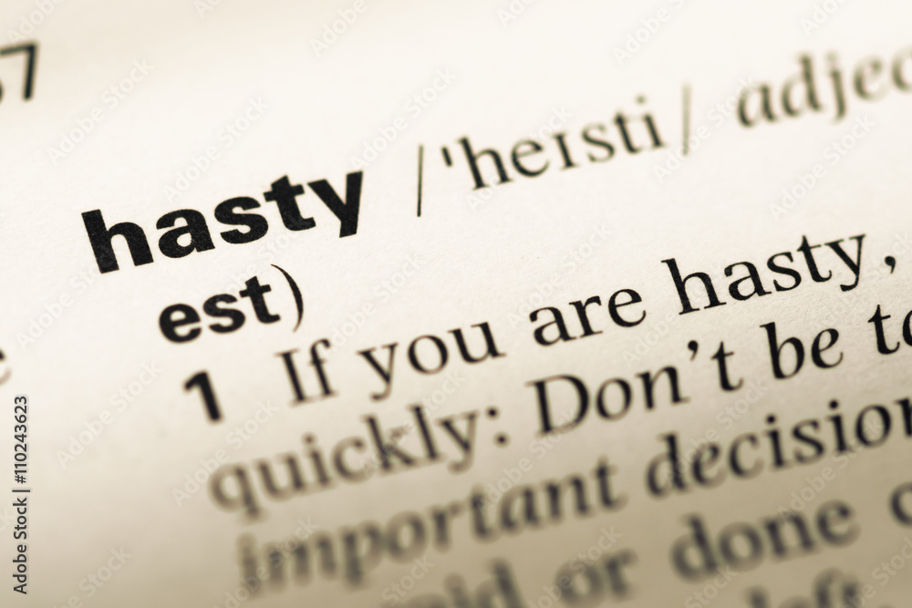 Close up of old English dictionary page with word hasty Close up of old English dictionary page with word hasty
