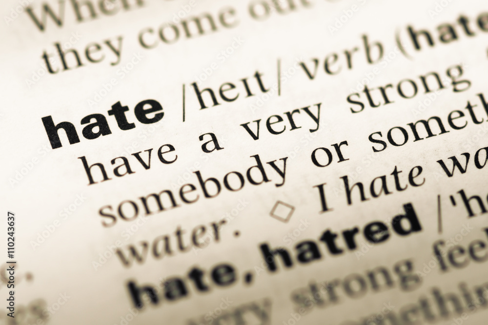 Close up of old English dictionary page with word hate Close up of old English dictionary page with word hate