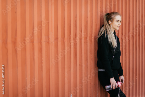 woman athlete drinking wate