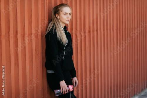 woman athlete drinking wate