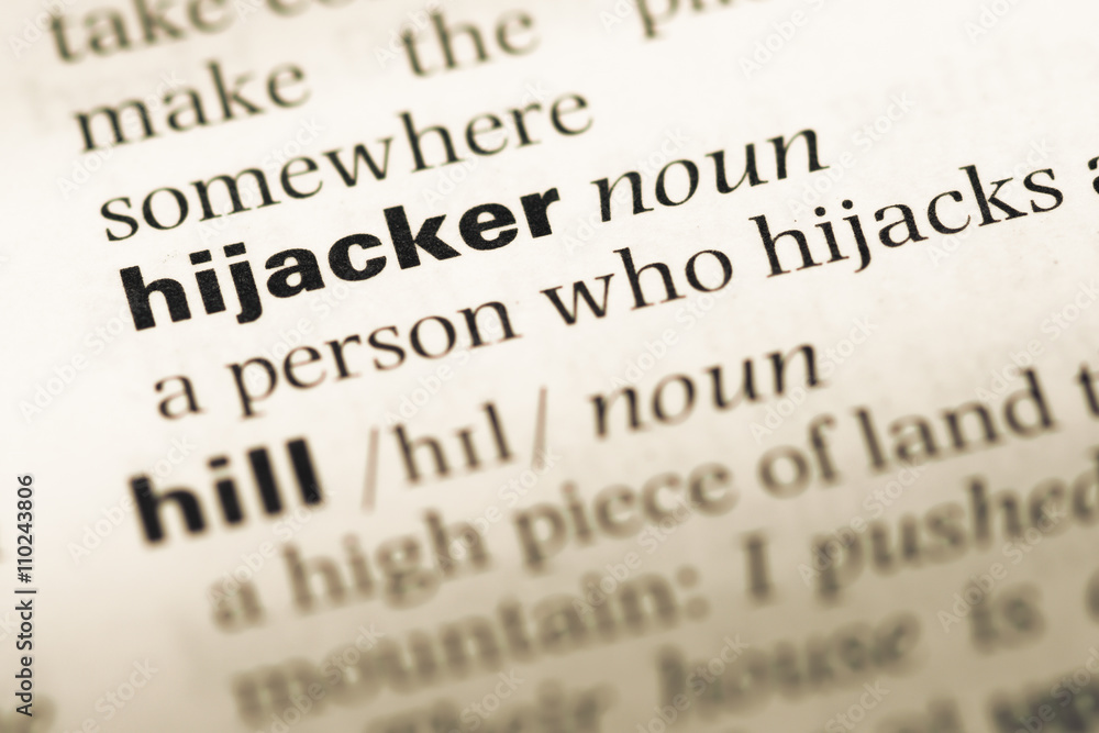Close up of old English dictionary page with word hijacker Close up of old English dictionary page with word hijacker