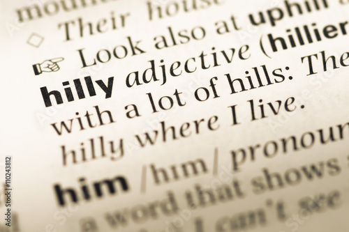 Close up of old English dictionary page with word hilly