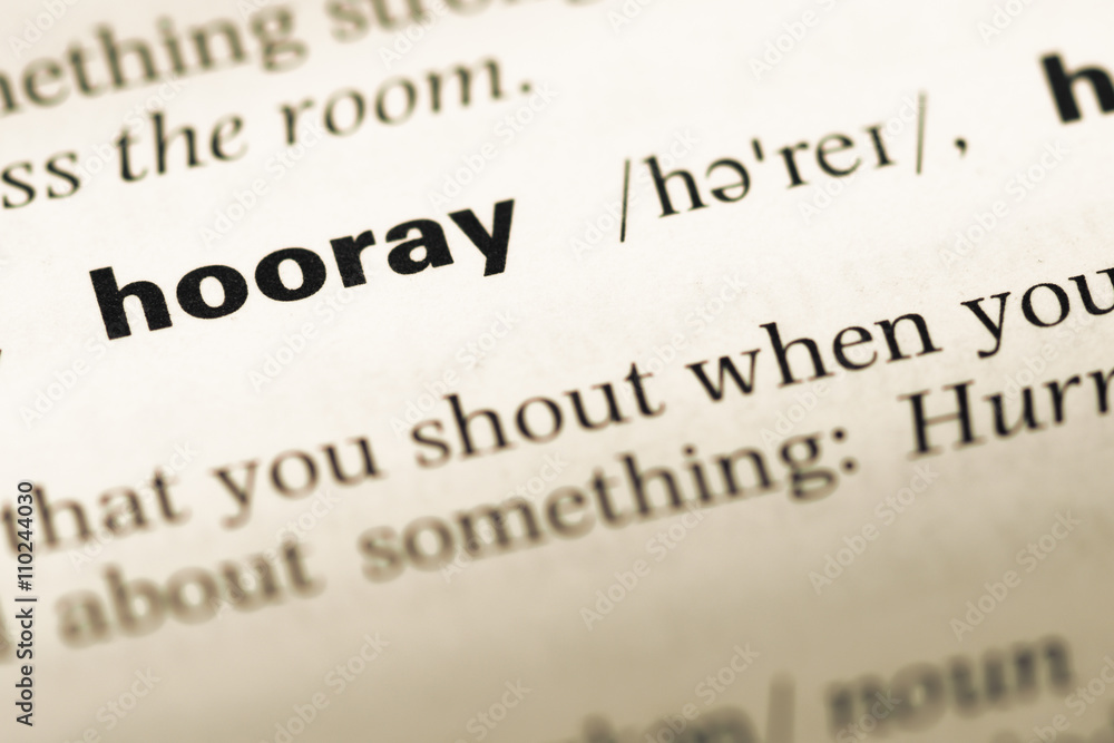 Close up of old English dictionary page with word hooray Close up of old English dictionary page with word hooray