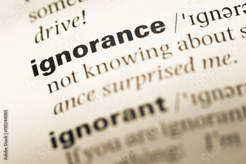 Close up of old English dictionary page with word ignorance
