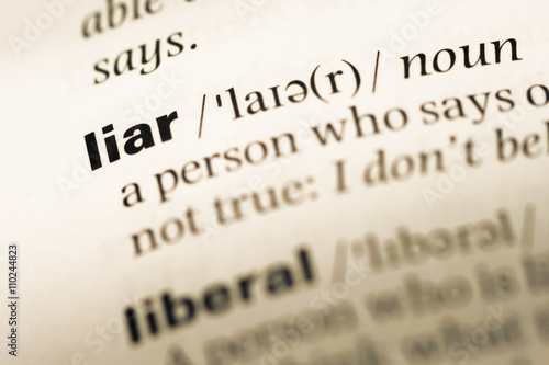 Принти на полотні Close up of old English dictionary page with word liar