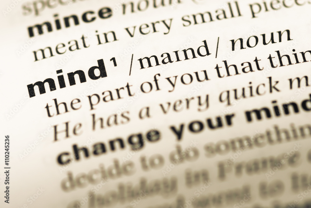 Close up of old English dictionary page with word mind Close up of old English dictionary page with word mind