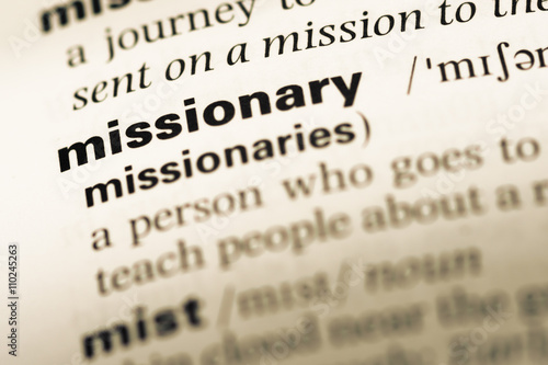 Close up of old English dictionary page with word missionary