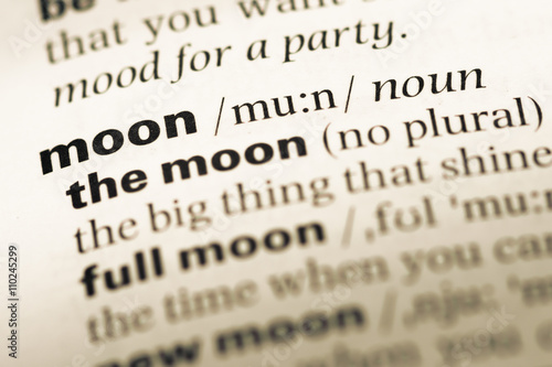 Close up of old English dictionary page with word moon