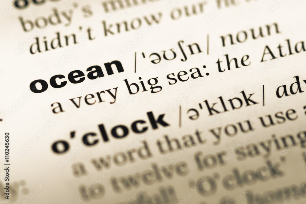 Close up of old English dictionary page with word ocean Close up of old English dictionary page with word ocean