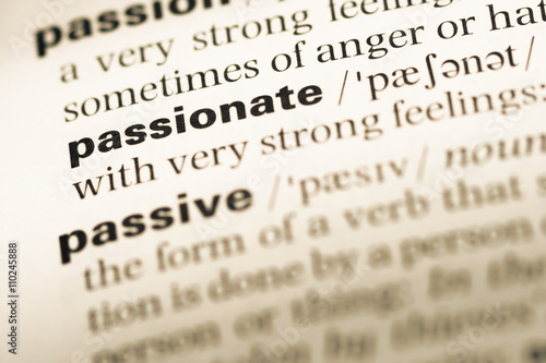 Φωτογραφία Close up of old English dictionary page with word passionate
