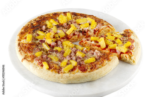 ham and pineapple pizza on a tray