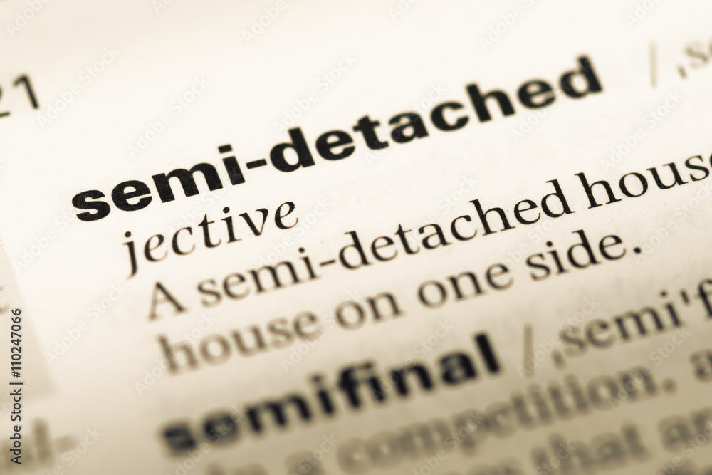Close up of old English dictionary page with word semi detached Close up of old English dictionary page with word semi detached