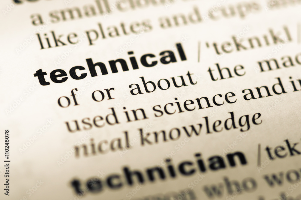 Close up of old English dictionary page with word technical Close up of old English dictionary page with word technical