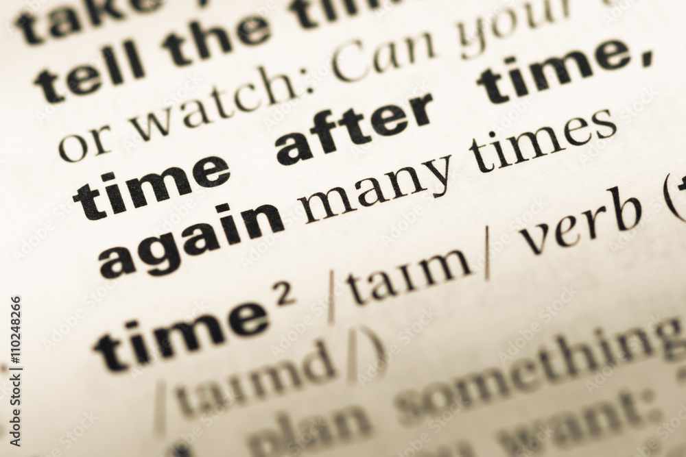 Fototapeta premium Close up of old English dictionary page with word time after tim