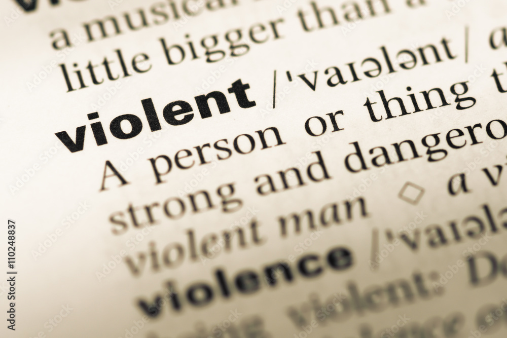 Close up of old English dictionary page with word violent Close up of old English dictionary page with word violent