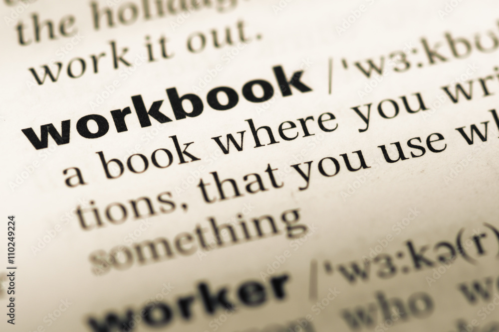 Obraz premium Close up of old English dictionary page with word workbook