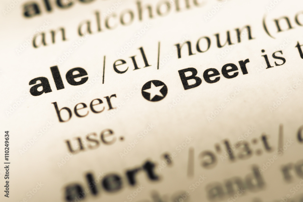 Close up of old English dictionary page with word ale Close up of old English dictionary page with word ale
