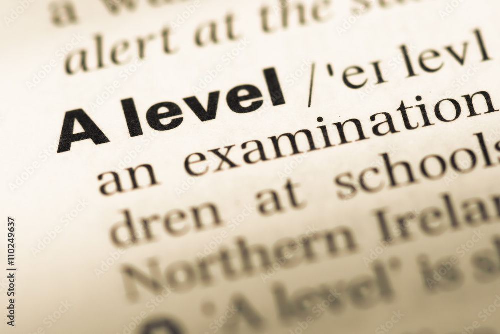 Obraz premium Close up of old English dictionary page with word A level