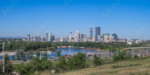 View of the Calgary skyline looking west. Deerfoot trail is in the foreground in front of the Bow River. photo