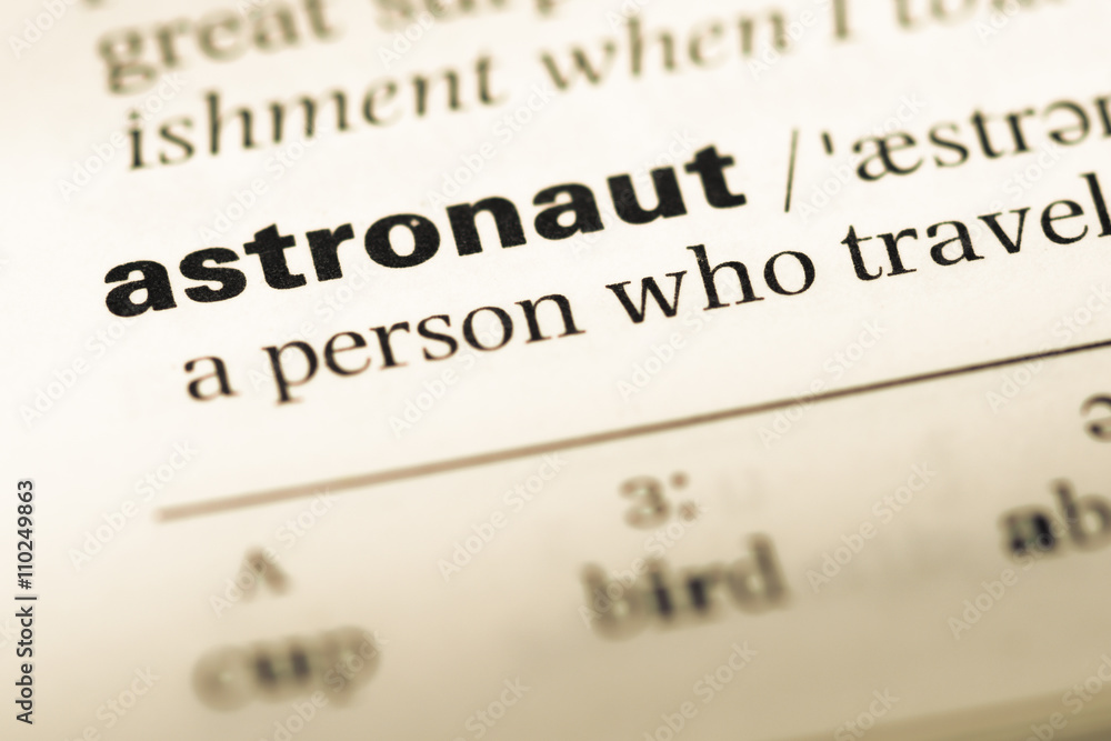 Close up of old English dictionary page with word astronaut Close up of old English dictionary page with word astronaut