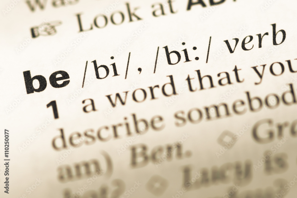 Close up of old English dictionary page with word be Close up of old English dictionary page with word be