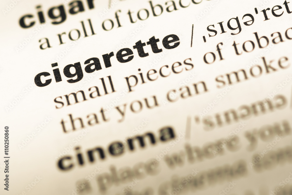 Close up of old English dictionary page with word cigarette Close up of old English dictionary page with word cigarette